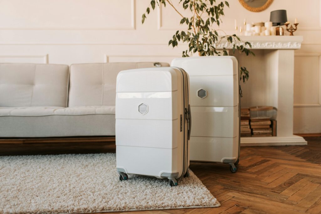 A photo of two cream suitcases in front of a sofa. 

Photo by Vlada Karpovich: https://www.pexels.com/photo/suitcases-beside-a-sofa-7368309/